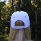 "He's Golfing" Embroidered Two Tone Hat - Green